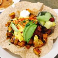 Grande Huevos Rancheros · Potatoes, chipotle peppers, chicken chorizo, black beans, cheddar jack in a wheat tortilla. ...