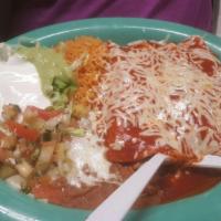 Enchilada · Corn tortilla filled with cheese or choice of meat covered with our enchilada sauce and Jack...