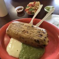 Chimichanga · Crispy fried burrito filled with rice, beans, cheese and choice of meat topped with sour cre...