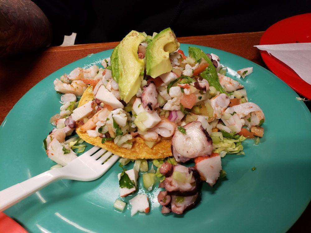 Tostada · Crispy corn tortilla topped with beans, choice of meat, lettuce, sour cream, guacamole, salsa and Jack cheese.