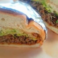 Torta · Grilled sandwich, filled with Jack cheese, refried beans, sour cream, guacamole, lettuce, to...