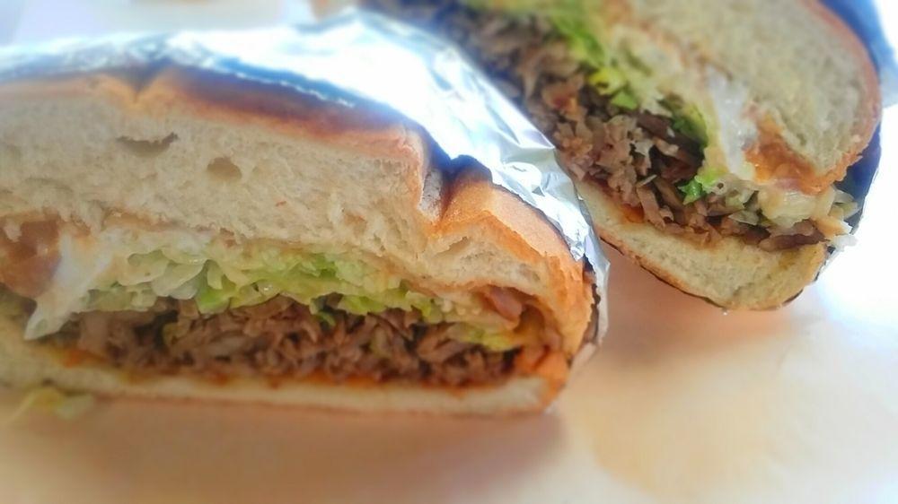 Torta · Grilled sandwich, filled with Jack cheese, refried beans, sour cream, guacamole, lettuce, tomatoes and choice of meat.