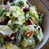 Topolino Salad · Romaine lettuce, red onions, feta cheese and raisins topped with cranberries and almond slic...