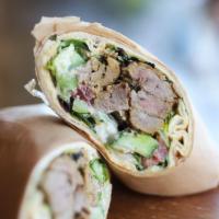 Filet Mignon Wrap · Wrapped with romaine lettuce, cucumbers, tomatoes, pickles, hummus spread, tahini and garlic...