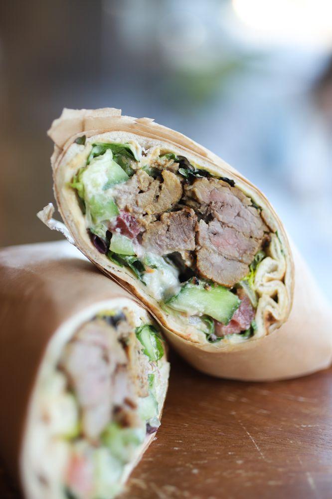 Filet Mignon Wrap · Wrapped with romaine lettuce, cucumbers, tomatoes, pickles, hummus spread, tahini and garlic sauce.