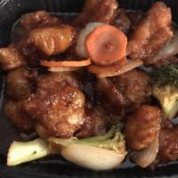 General Tso Chicken · Onions, broccoli and carrots glazed with spicy sauce. Comes with steamed white rice.