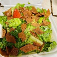 Fattoush Salad · Chopped fresh Romaine lettuce, tomatoes, cucumbers, mint, seasoned fried pita chips and toss...