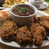 Southern Fried Chicken Dinner · Southern fried chicken wings served with a side of red beans and rice.