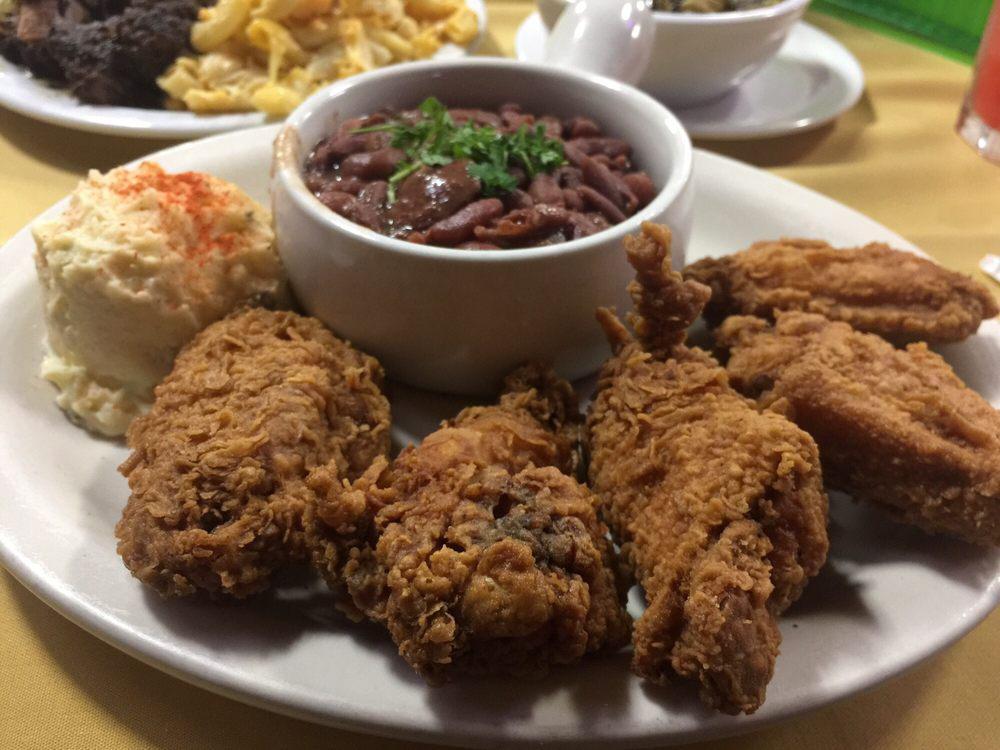 Southern Fried Chicken Dinner · Southern fried chicken wings served with a side of red beans and rice.