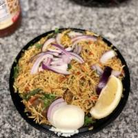 Goat Biryani · Long grain basmati rice flavored with saffron and cooked with goat and herbs. Served with ra...