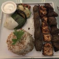 Mixed Grill · Chicken shish taouk, beef kebab and kafta. Served with rice & grilled vegetables