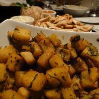 Batata Harra · Sauteed spicy potato cubes, garlic and fresh coriander.