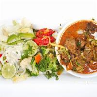 Curry Goat · Cubes of goat meat in bones cooked with our specialty blended curry sauce.