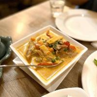 Red Curry · Bomboo shoots, peas and carrots, bell peppers, and basil in coconut red curry cream sauce. S...