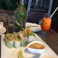 Summer Rolls · Soft rice paper filled with egg, rice noodle, and julienne vegetables. Sliced bite-sized and...