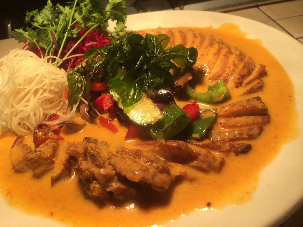 Panang Curry Duck · Roasted duck with panang curry cream sauce and sauteed vegetables. Served with steamed jasmine rice.