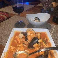 Cioppino · Traditional seafood stew served on a light spicy tomato broth and served on toasted homemade...