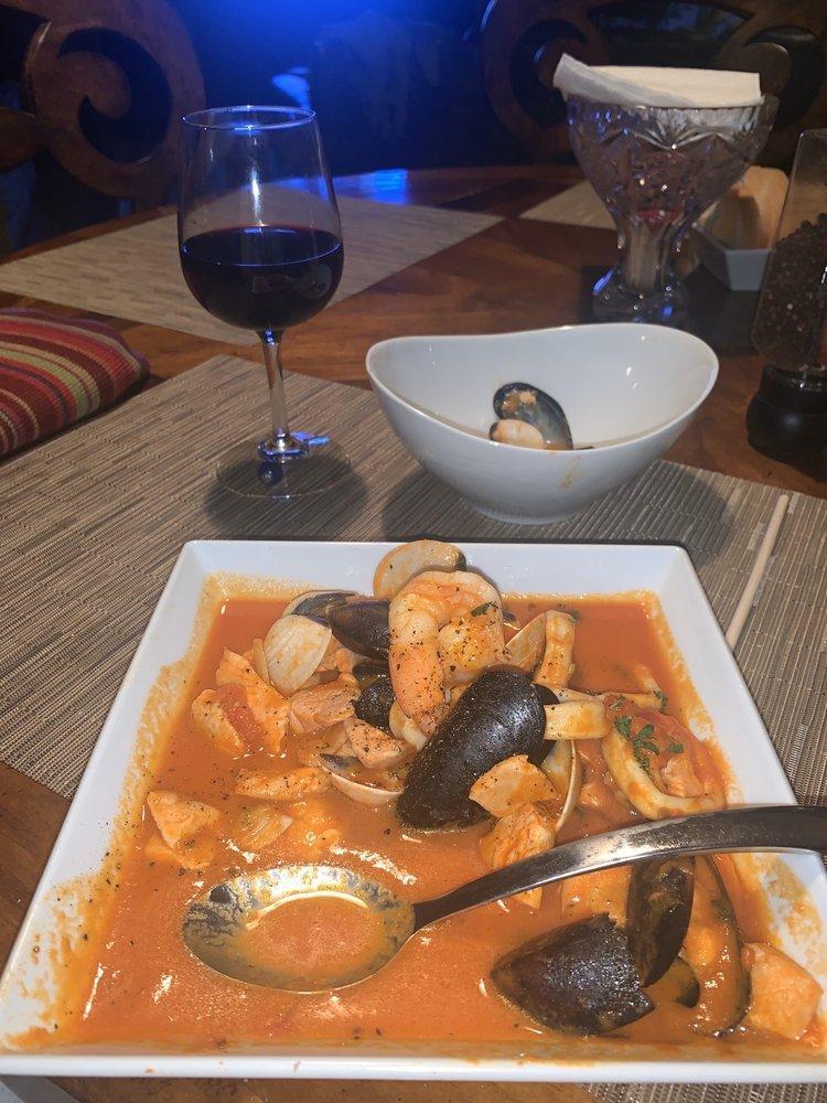 Cioppino · Traditional seafood stew served on a light spicy tomato broth and served on toasted homemade ciabatta bread.