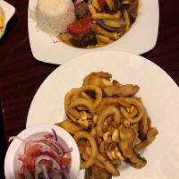Lomo Saltado · Our signature dish! We use only the finest certified angus beef C.A.B. sauteed with onions a...