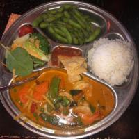 Red Curry · Bamboo shoots, basil, carrots, snow peas and bell peppers simmered in coconut milk.