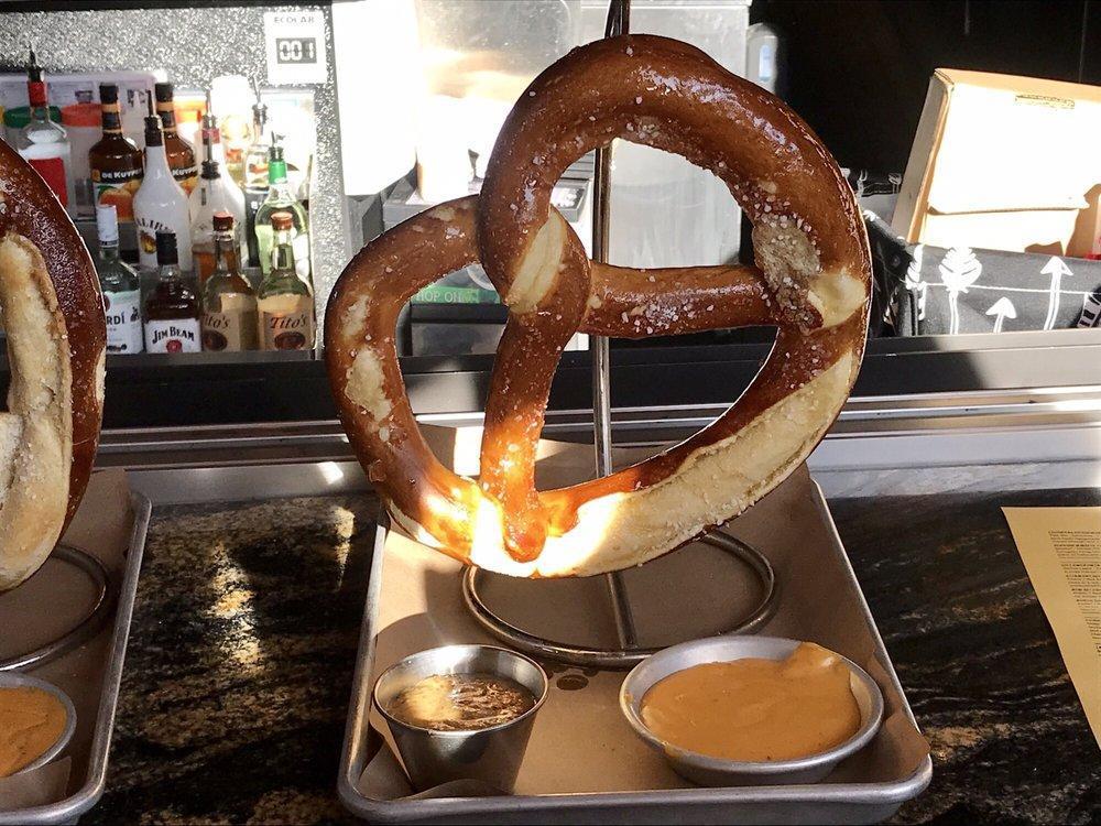 German Pretzel · A WOB original and tavern favorite. A giant Bavarian pretzel baked soft on the inside, crispy on the outside and salted. Served with housemade stone ground mustard.