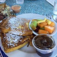 Challah French Toast · Thickly sliced challah dipped in milk, eggs, cinnamon and vanilla, then grilled golden brown...