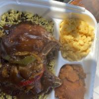 Smothered Louisiana Style Pork Chops with Rice · Includes two sides orders and cornbread. 
