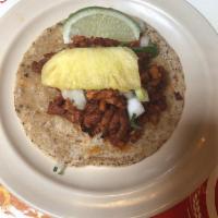 Al Pastor Taco · The ultimate Mexico City street taco. Thinly sliced, marinated heritage pork served with cil...