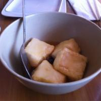 Agedashi Tofu · Fried bean curd, served with bonito flakes and tempura sauce.