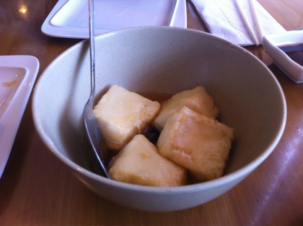 Agedashi Tofu · Fried bean curd, served with bonito flakes and tempura sauce.