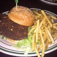 Crispy Clucker Sandwich · Deep fried chicken, Sriracha-mayo, lettuce, tomato, and burger bun.