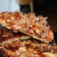 Okonomiyaki · Japanese egg pancake with bacon, shrimp and squid topped with bonito flakes, japanese mayo a...