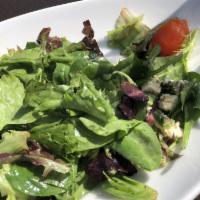 Greek Salad · Tomatoes, cucumbers, red onions, olives, feta, and red wine vinaigrette. Gluten-free, vegeta...