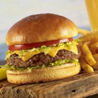 Cheeseburger in Paradise · Our signature burger topped with American cheese, lettuce, tomatoes and pickles.