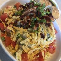 The Original BBQ Chicken Chopped Salad · Black beans, sweet corn, jicama, fresh cilantro and basil, crispy corn tortilla strips, Mont...