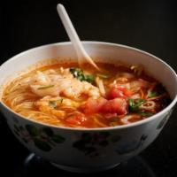 Tom Yum Soup · Spicy lemongrass chicken broth with rice noodles, vegetables 
( 32 oz soup)