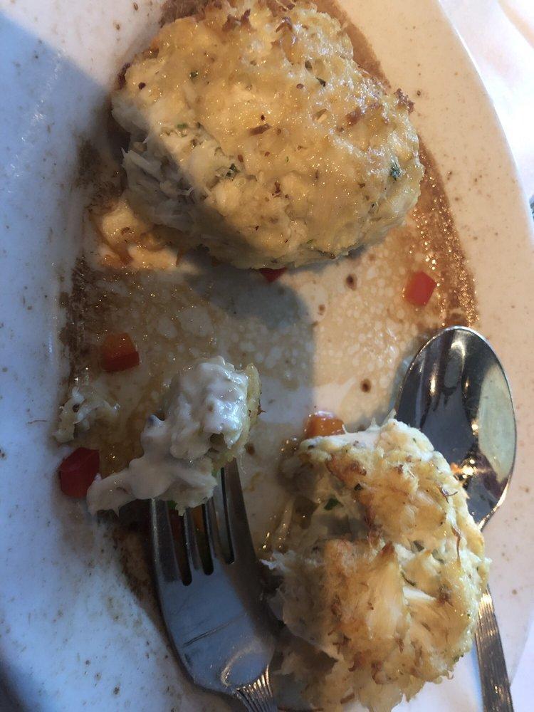Sizzling Crab Cakes · Two jumbo lump crab cakes with lemon butter.