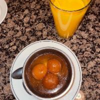Gulab Jamun · Fried dough balls dipped in our sweet honey syrup.