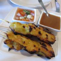 Chicken Satay · Grilled chicken on skewers served with cucumber salad and peanut sauce. 