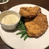 Southern Fried Chicken · Chicken breast marinated in buttermilk, rosemary & thyme. Served with white bacon gravy. Ser...