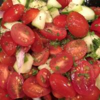 Israeli Salad · Tomato, cucumber, red onion, parsley, fresh mint, fresh lemon & olive oil dressing. Vegetari...