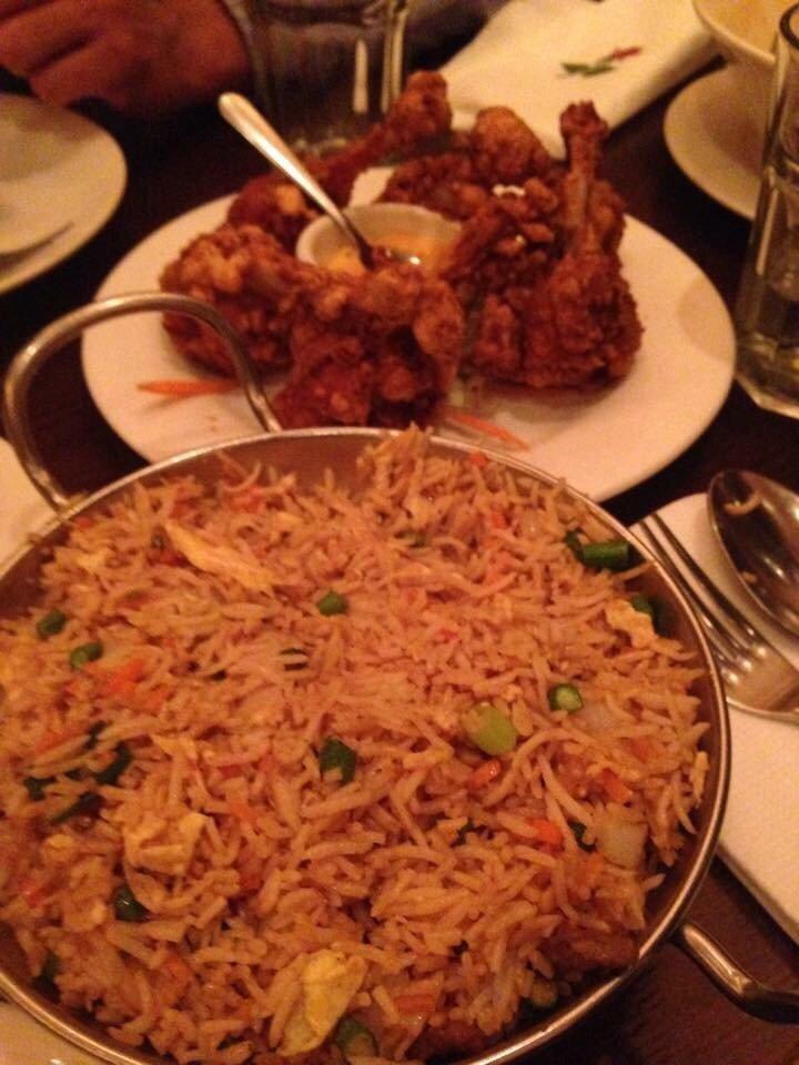 Chicken Biryani · Tender chicken cooked with basmati rice and flavored with saffron.
