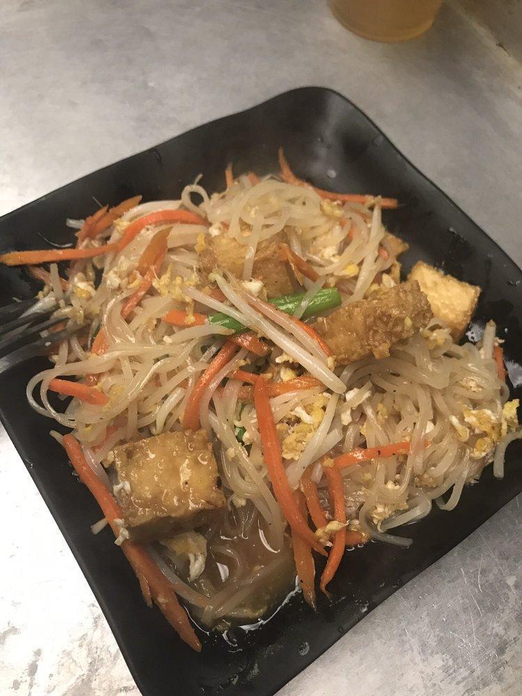 Pad Thai Noodle · Rice noodle stir-fried with egg, julienned carrot, bean sprouts, scallion and our tangy, sweet tamarind sauce topped with slices o f lime and crushed roasted peanuts, choose meat or vegetarian. Gluten free.