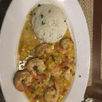 Mango Shrimp with Coconut Rice · Fresh gulf shrimp cooked down in our sweet house-made mango salsa.