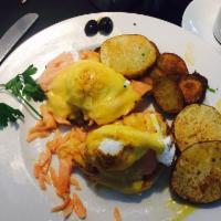 Classic Egg Benedict Breakfast · Poached eggs, Canadian bacon, English muffin, Hollandaise sauce and home-fried potatoes.