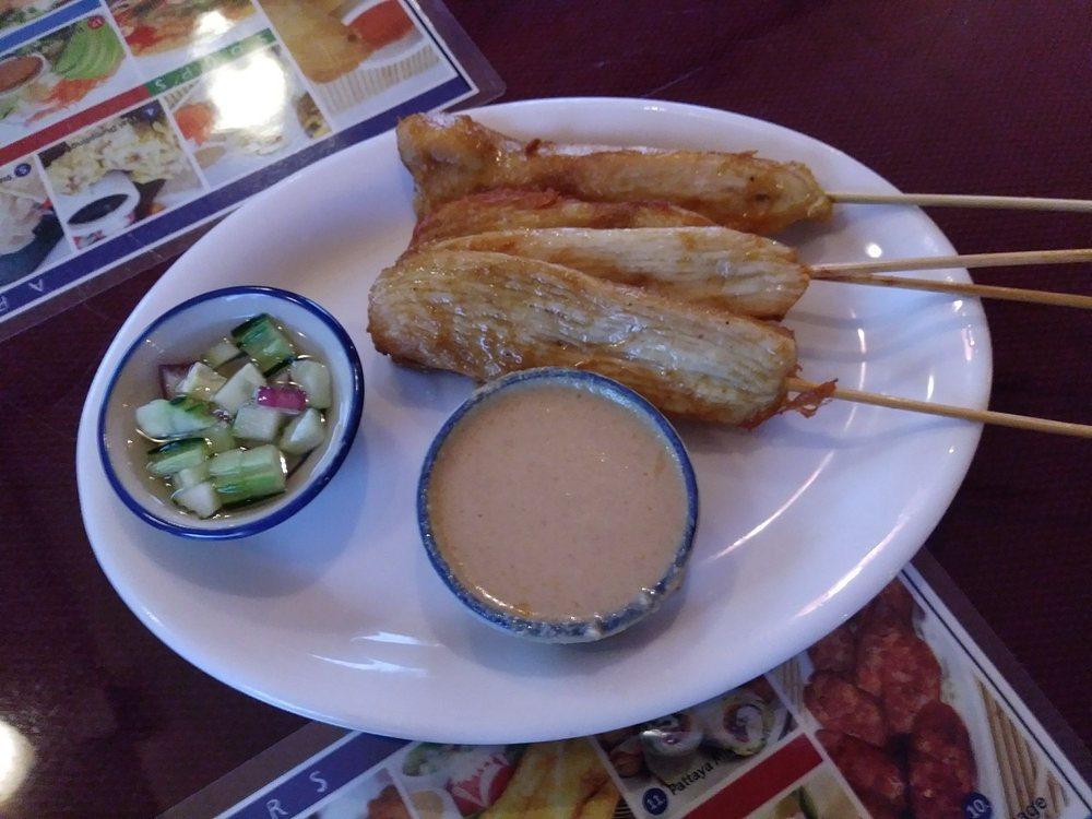 Chicken Satay · Small pieces of chicken grilled on a skewer, topped with coconut milk, and served with peanut sauce.
