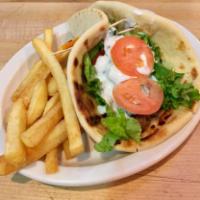 Lamb Gyro · Grilled lamb topped with lettuce, tomato, herbed red onions, banana peppers, homemade herbed...