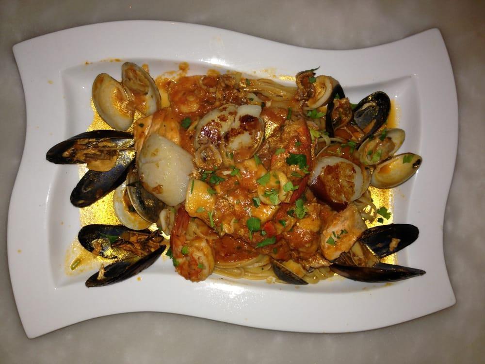 Cioppino · Mussels, clams, calamari, and shrimp served in red sauce over linguini pasta.