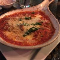 Cannelloni · Filled with beef, pork and veal meats, spinach and ricotta cheese, served with besciamella a...