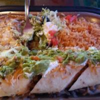 Chimichanga · Fried flour tortilla with chicken, ground beef, or shredded beef, zestfully blended with our...